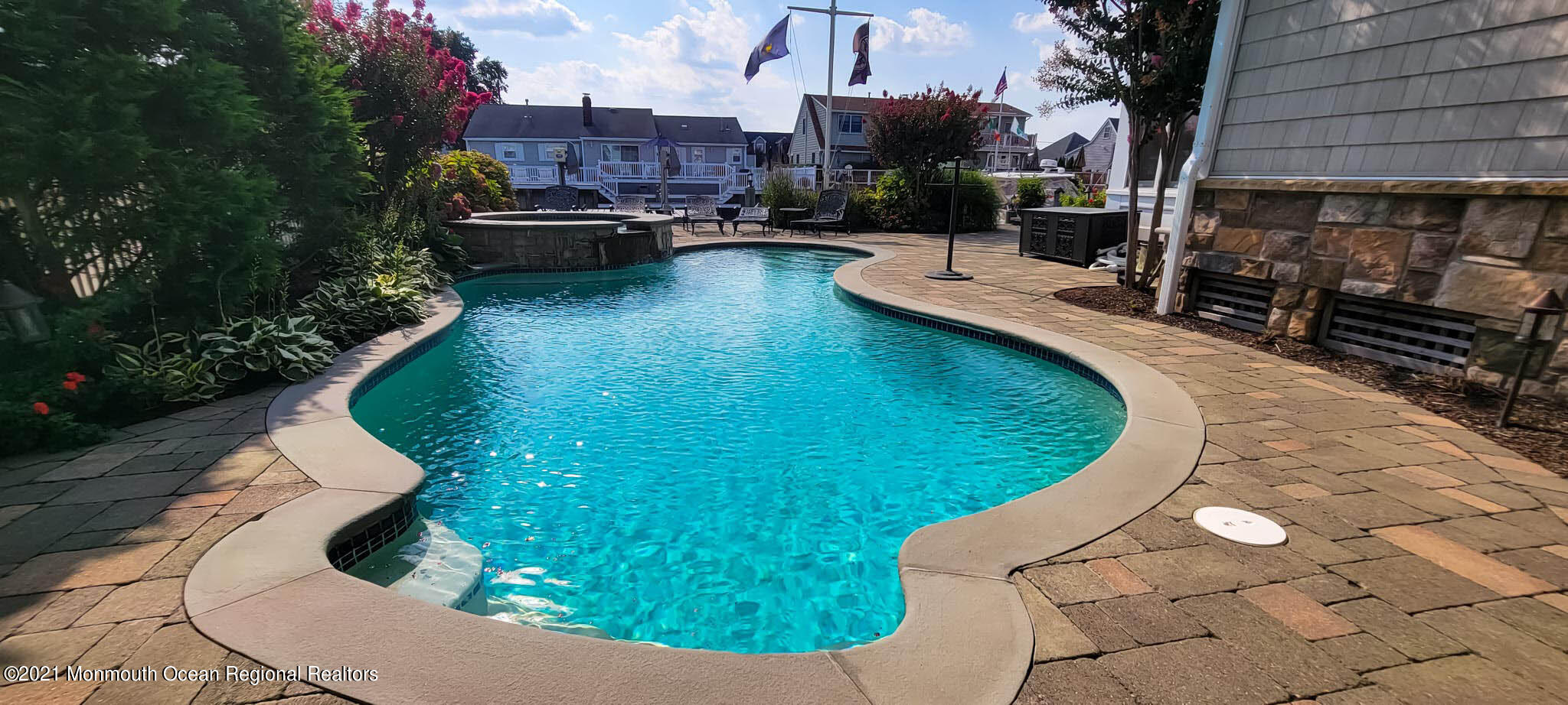 203 Ketch Road Mantoloking, NJ 08738 - Photo 77 of 88 a view of a swimming pool with sitting area