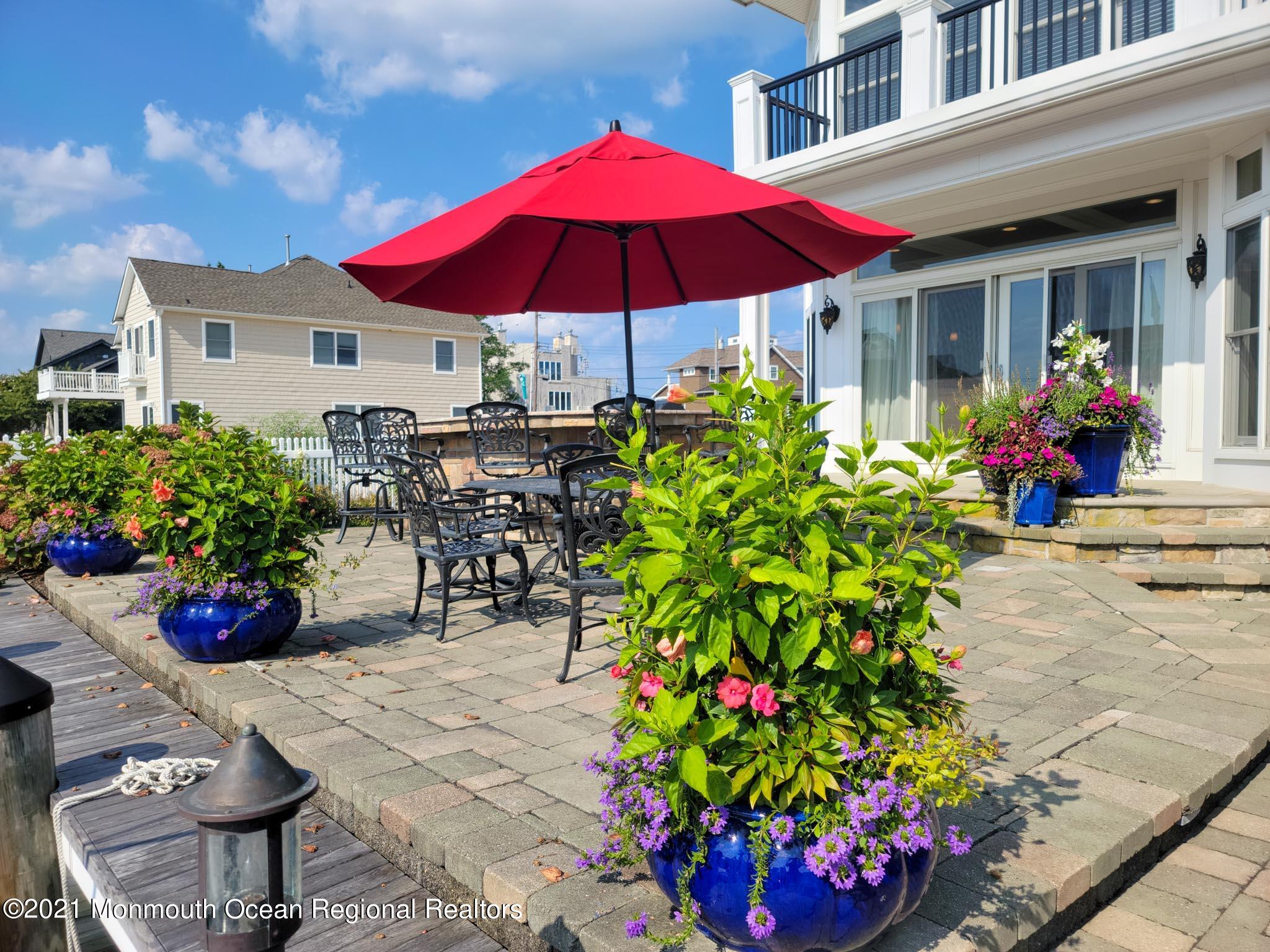 203 Ketch Road Mantoloking, NJ 08738 - Photo 79 of 88 a view of a house with a yard and sitting area