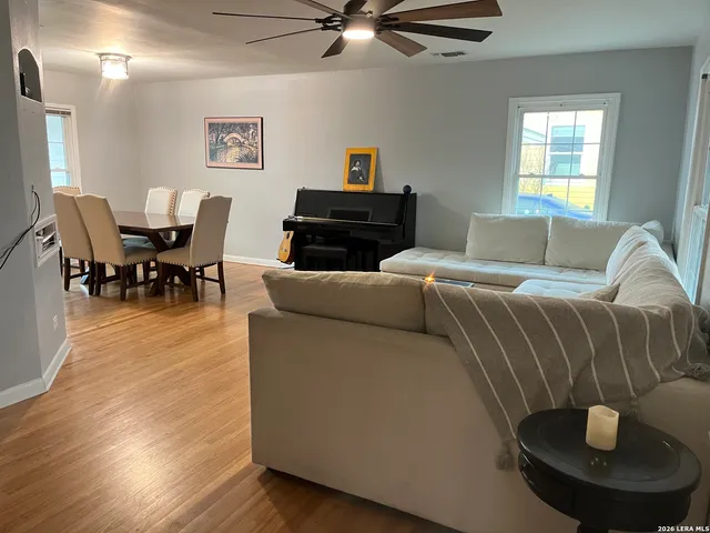 a living room with furniture and a window