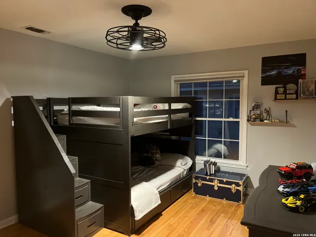 a kitchen with a refrigerator and a stove