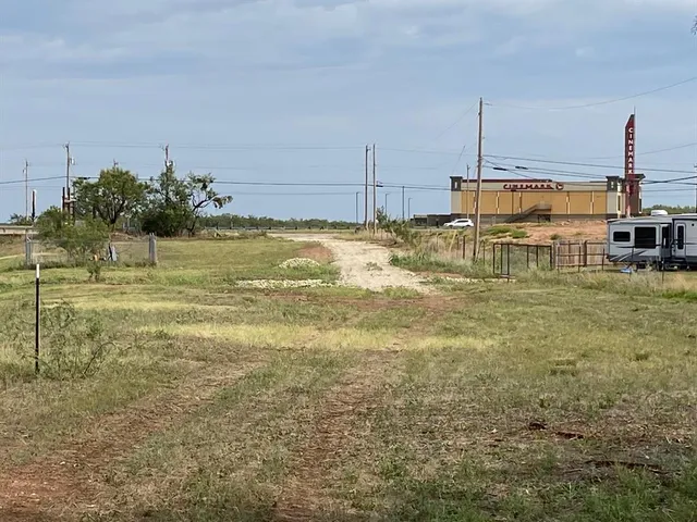 a view of a lake with houses in the back