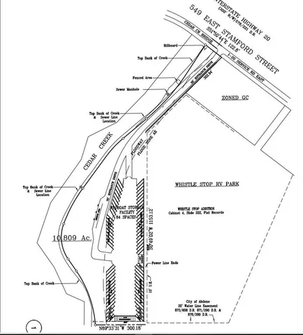 a street sign that is on a brick wall