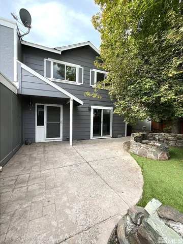 a backyard of a house with seating space