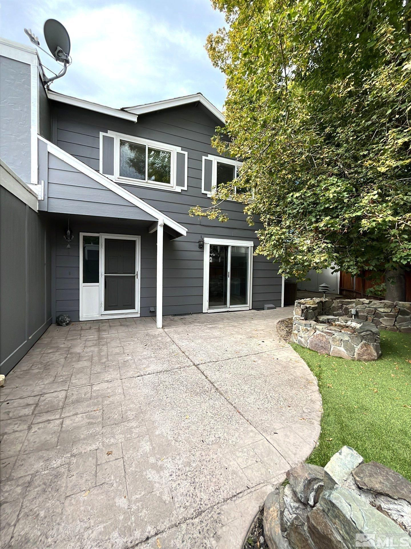 7513 Cumberland Circle Reno, NV 89511 - Photo 1 of 26 a backyard of a house with seating space