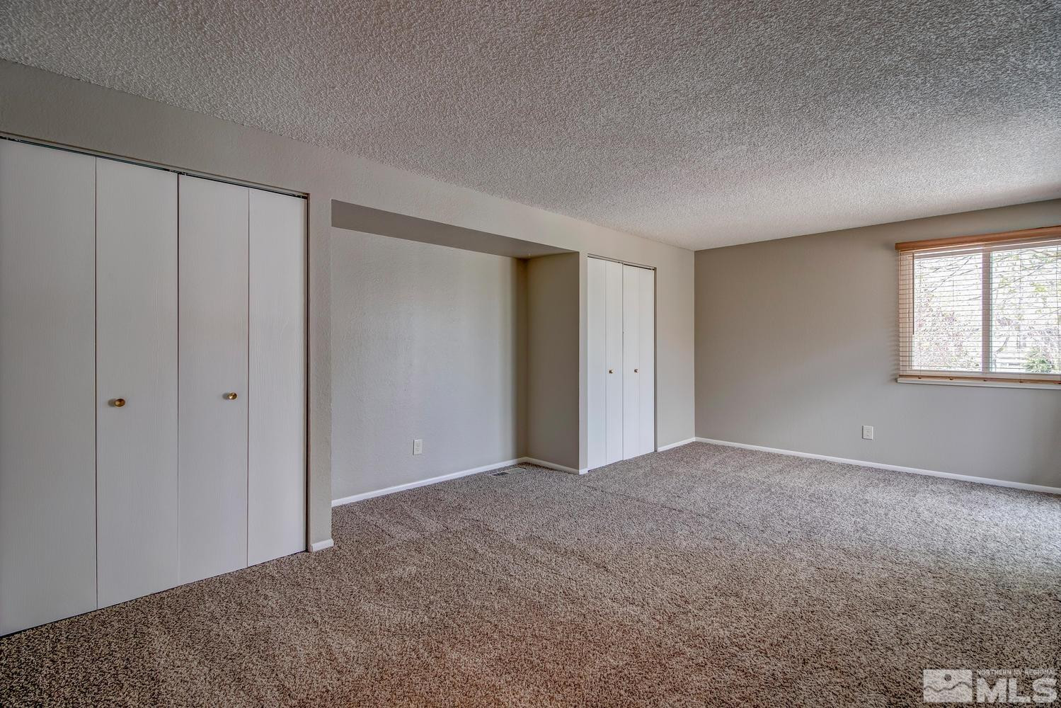 7513 Cumberland Circle Reno, NV 89511 - Photo 13 of 26 a view of an empty room and window