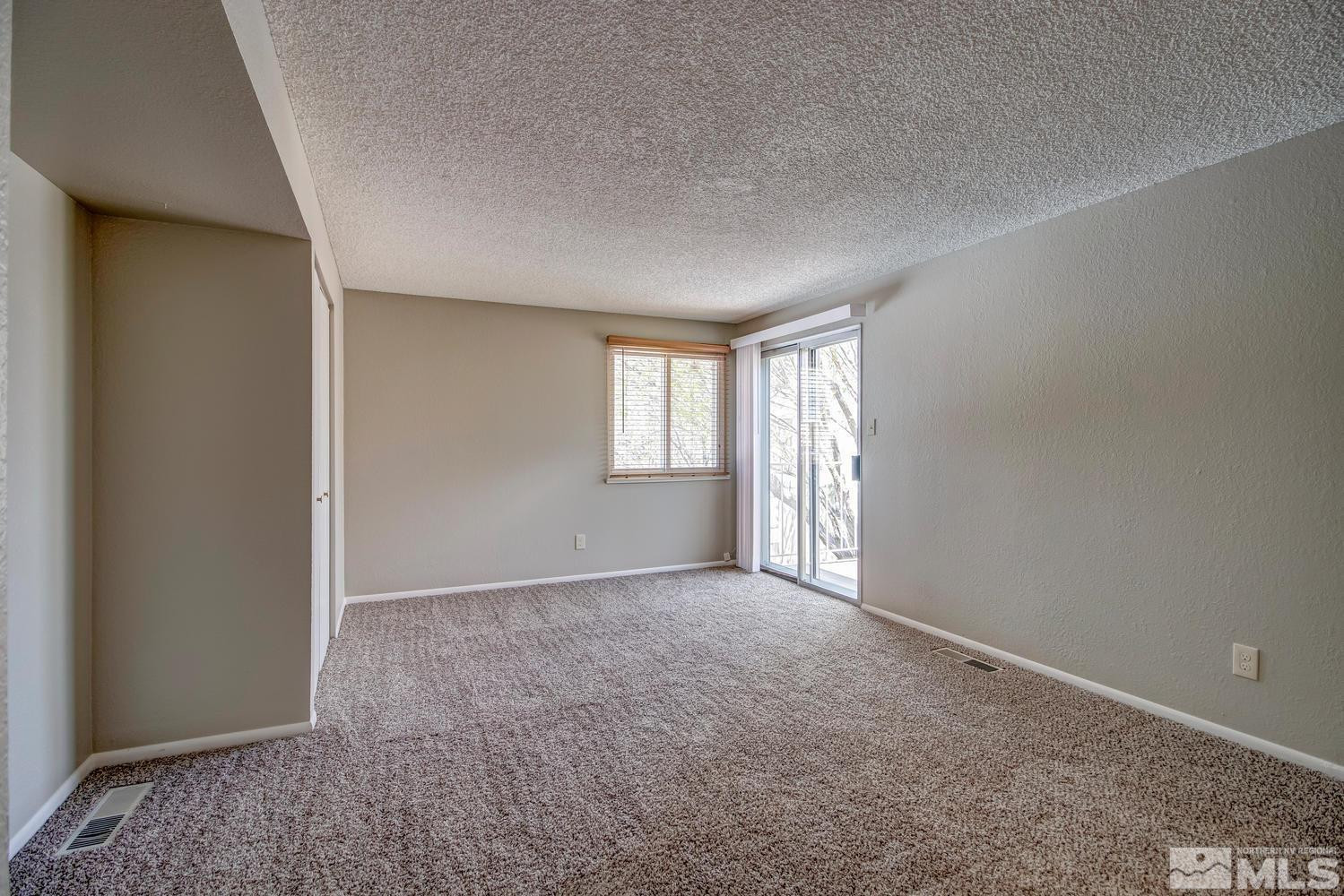 7513 Cumberland Circle Reno, NV 89511 - Photo 15 of 26 an empty room with windows