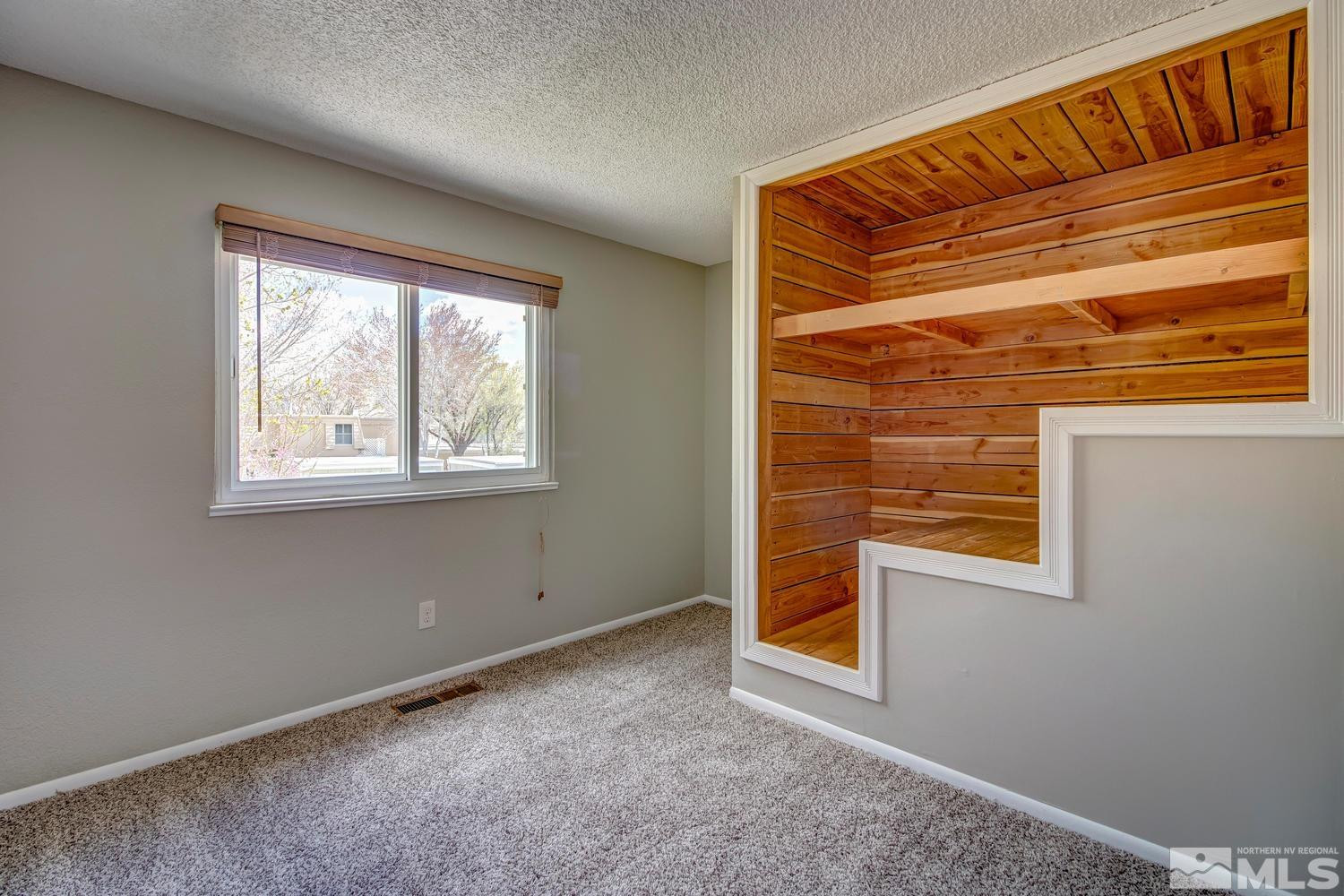 7513 Cumberland Circle Reno, NV 89511 - Photo 17 of 26 a view of an empty room with a window