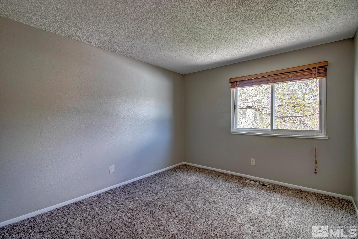 7513 Cumberland Circle Reno, NV 89511 - Photo 19 of 26 an empty room with windows