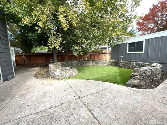 a view of a backyard of the house