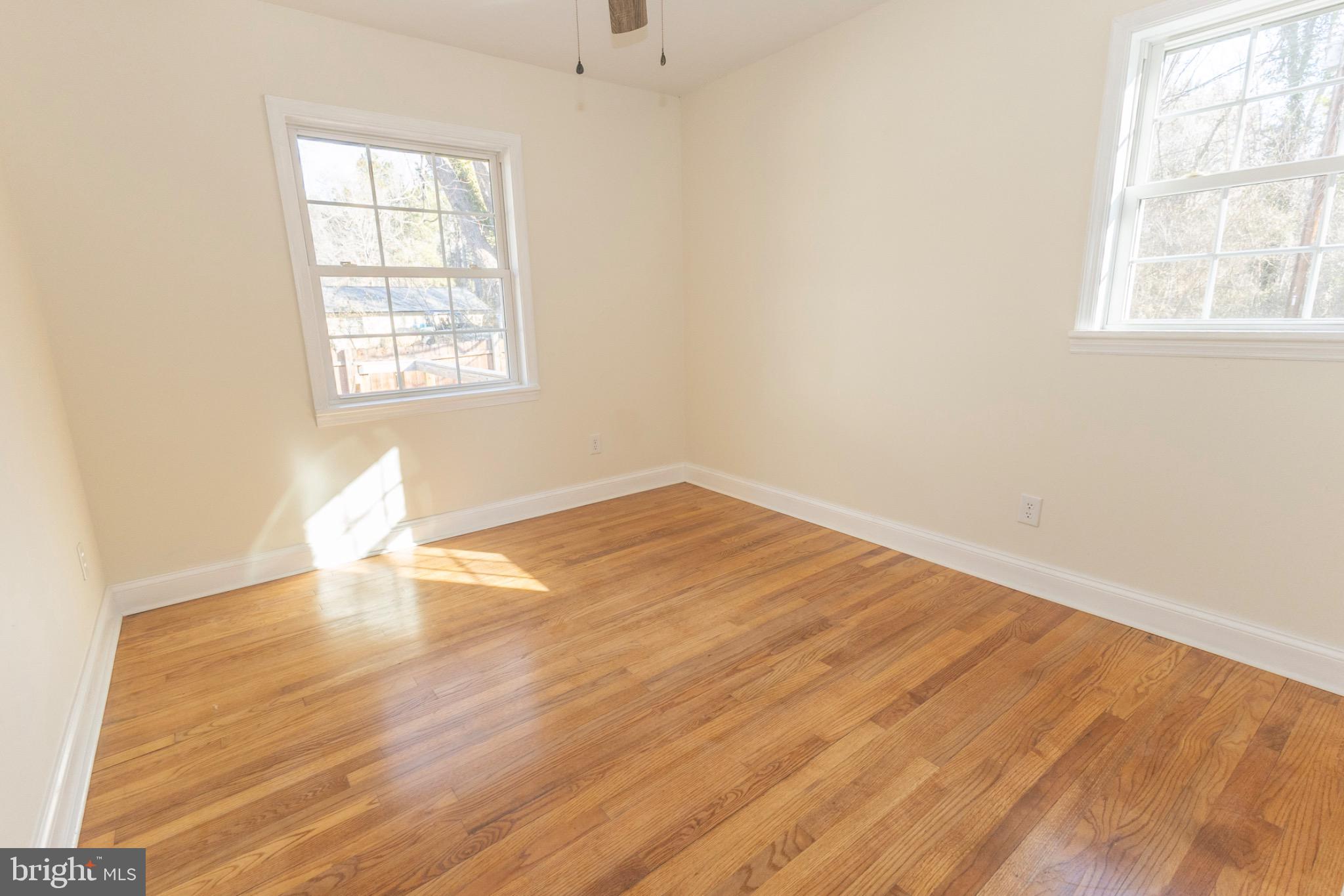 49151 Wynne Road Ridge, MD 20680 - Photo 44 of 80 Bright and airy bedroom with hardwood floors.