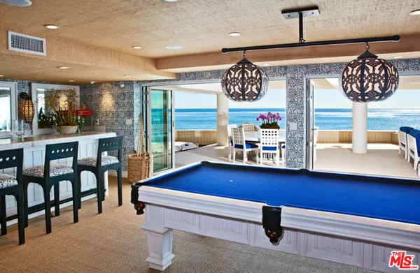 a room with lots of furniture and window