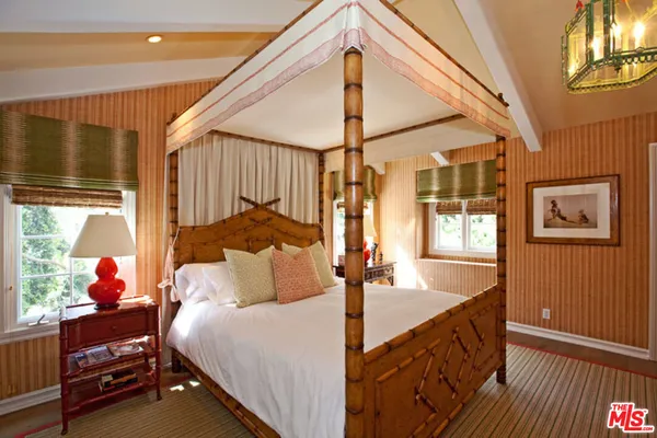 a bed room with a bed and a window