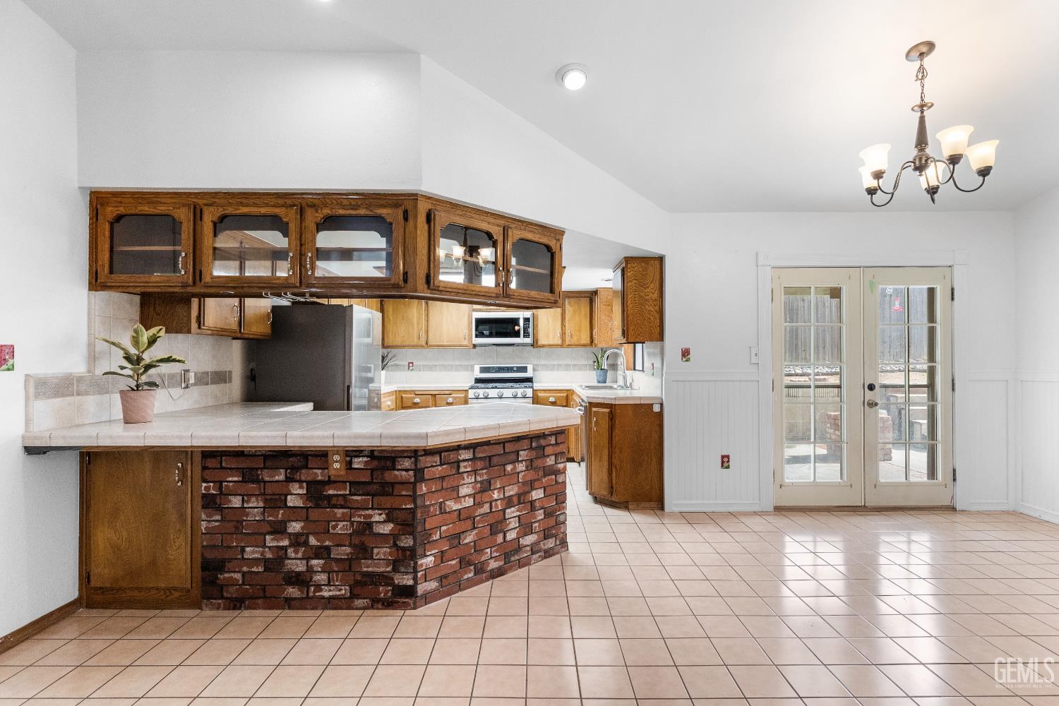 Undisclosed Address Tehachapi, CA 93561 - Photo 11 of 38 a kitchen with stainless steel appliances a sink stove and cabinets