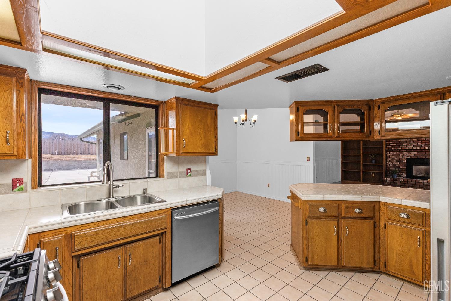 Undisclosed Address Tehachapi, CA 93561 - Photo 13 of 38 a kitchen with a sink cabinets and window
