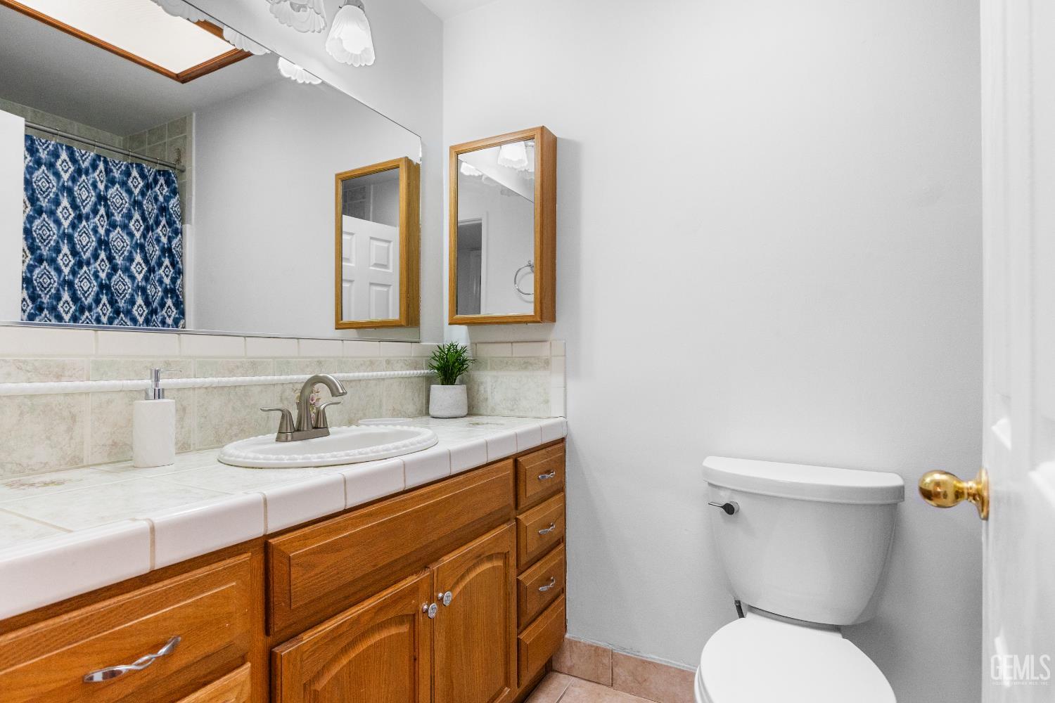 Undisclosed Address Tehachapi, CA 93561 - Photo 22 of 38 a bathroom with a toilet sink and mirror