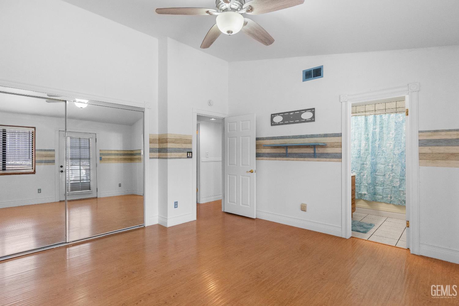 Undisclosed Address Tehachapi, CA 93561 - Photo 26 of 38 a view of a kitchen with refrigerator and wooden floor