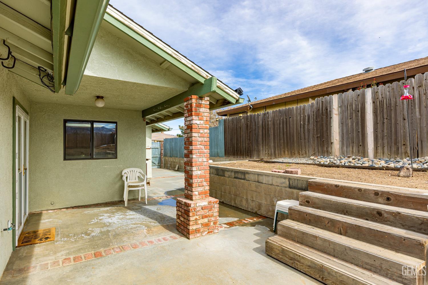 Undisclosed Address Tehachapi, CA 93561 - Photo 28 of 38 a view of a porch with a table and chairs