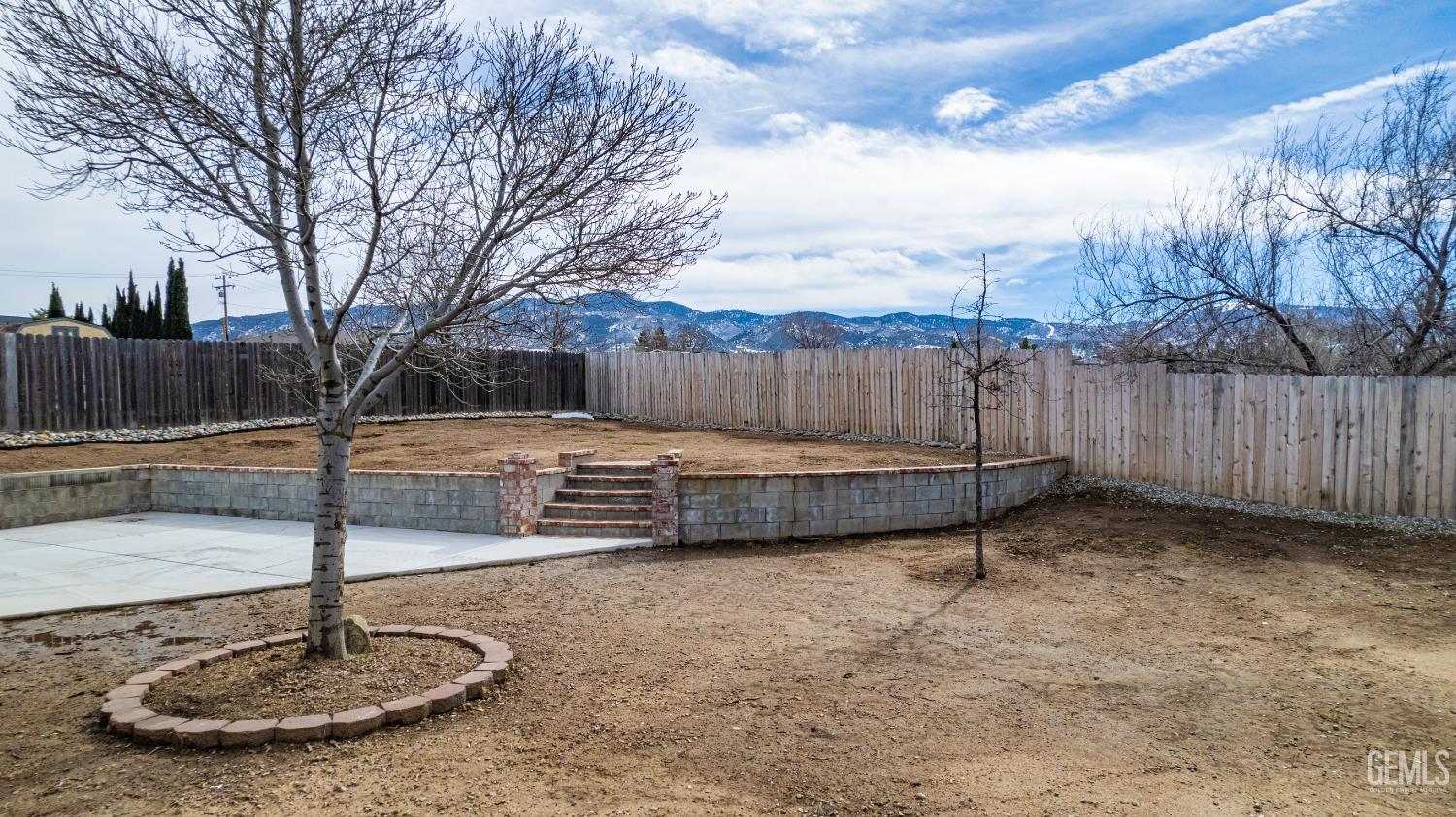 Undisclosed Address Tehachapi, CA 93561 - Photo 32 of 38 a view of a backyard with wooden fence