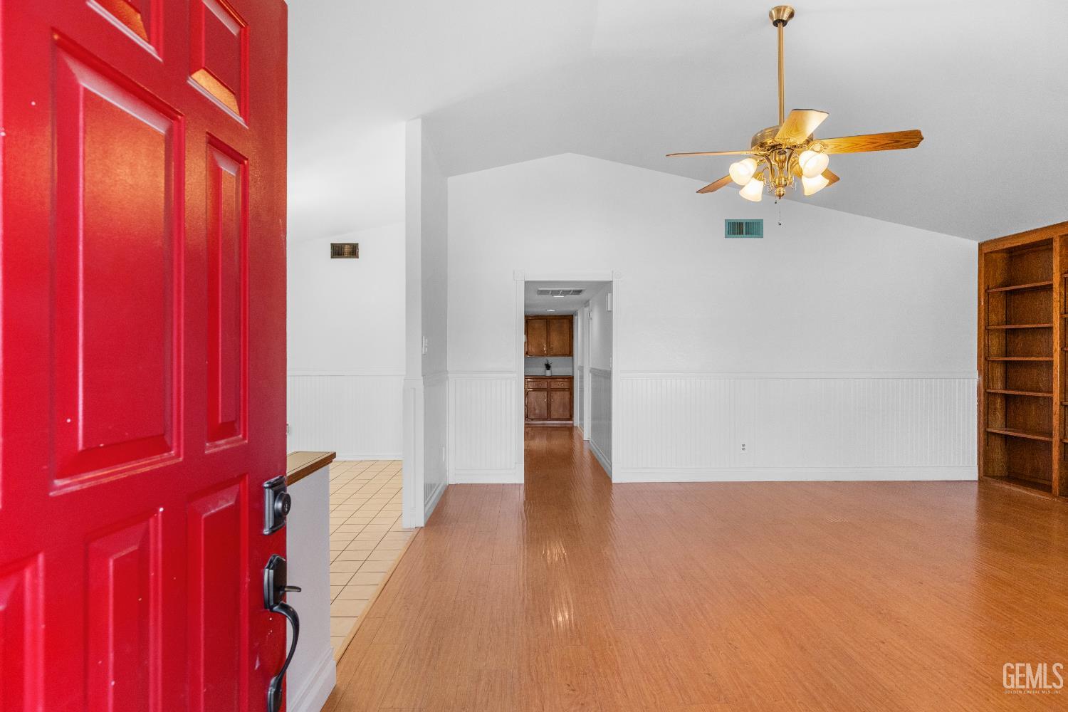 Undisclosed Address Tehachapi, CA 93561 - Photo 5 of 38 a view of an empty room with wooden floor and windows