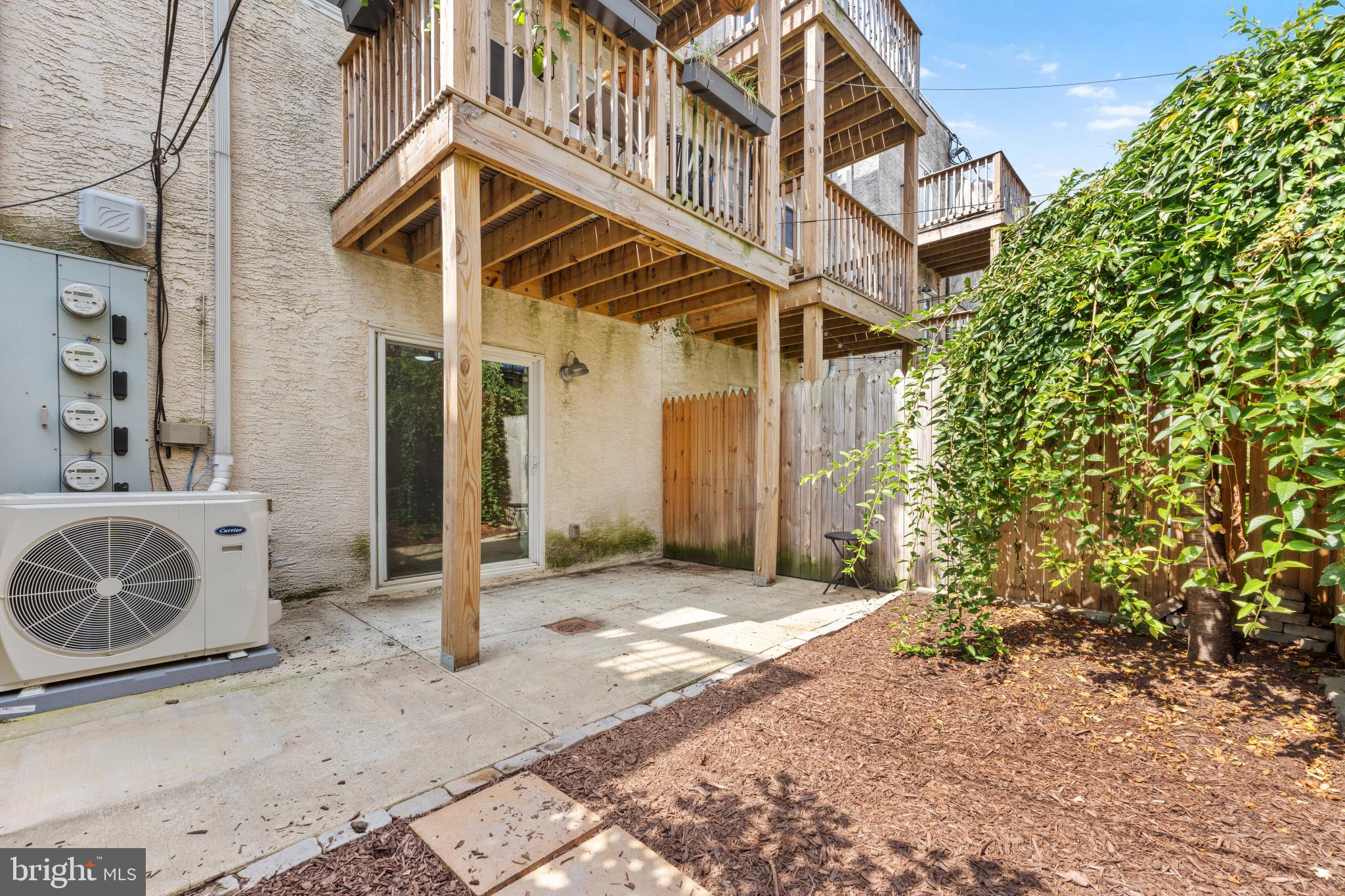 2123 Christian Street, Unit A Philadelphia, PA 19146 - Photo 11 of 15 a view of a house with backyard and trees