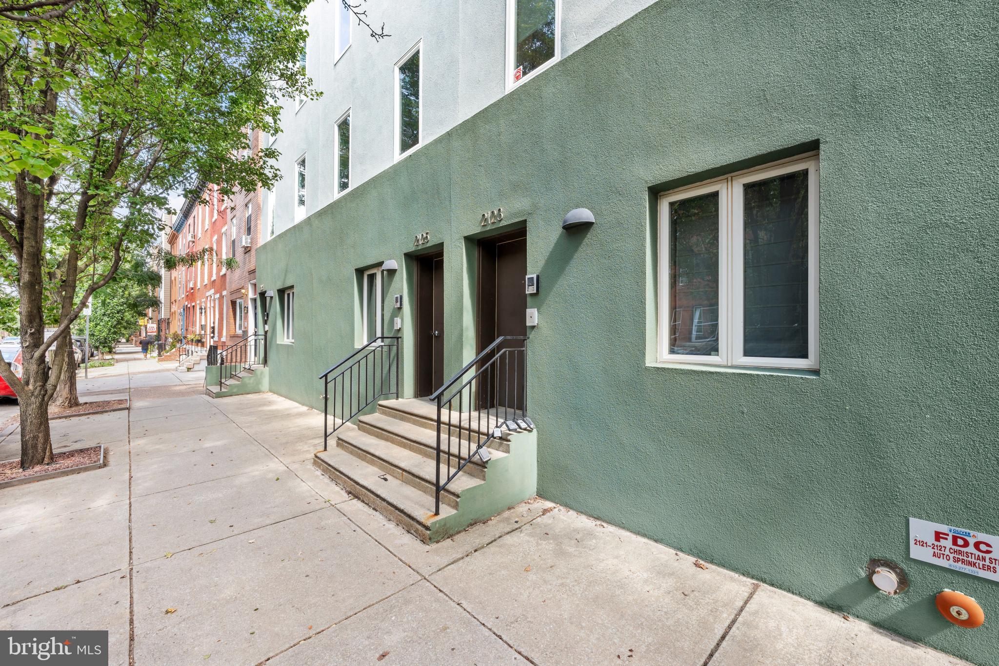 2123 Christian Street, Unit A Philadelphia, PA 19146 - Photo 15 of 15 a view of backyard with a chair and potted plants
