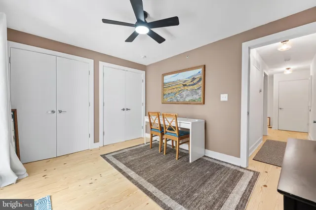 a view of a livingroom with furniture and wooden floor