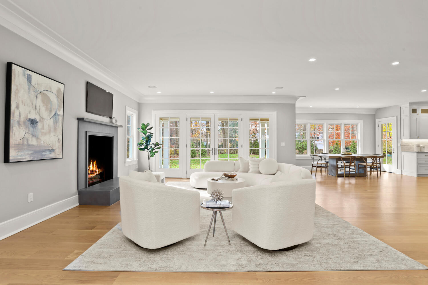 24 Country Club Road New Canaan, CT 06840 - Photo 12 of 43 a living room with couches and a fireplace with wooden floor