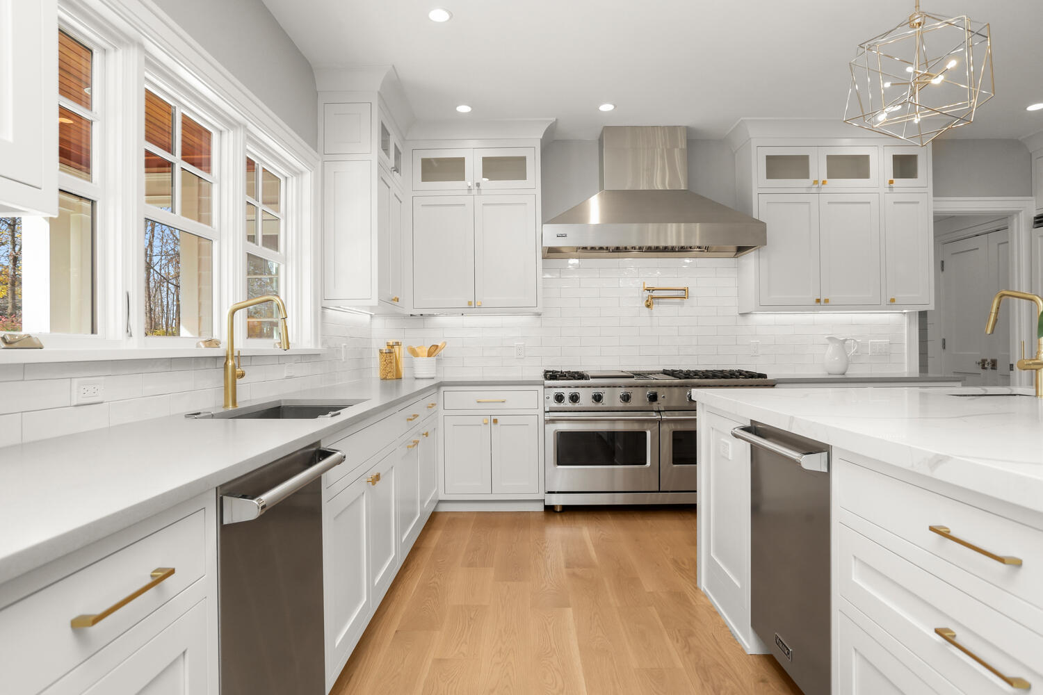 24 Country Club Road New Canaan, CT 06840 - Photo 18 of 43 a kitchen with stainless steel appliances a sink stove and cabinets