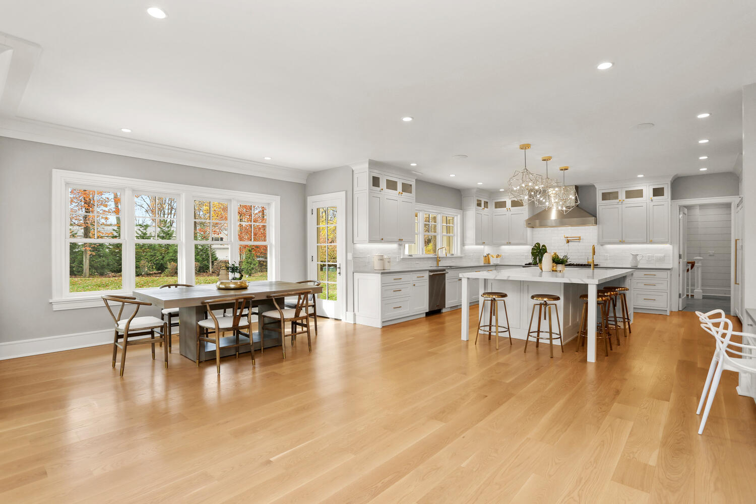24 Country Club Road New Canaan, CT 06840 - Photo 20 of 43 a dining room with stainless steel appliances a dining table chairs and a large window