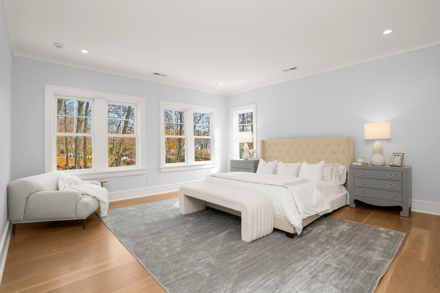 24 Country Club Road New Canaan, CT 06840 - Photo 27 of 43 a spacious bedroom with a bed and a couch with window