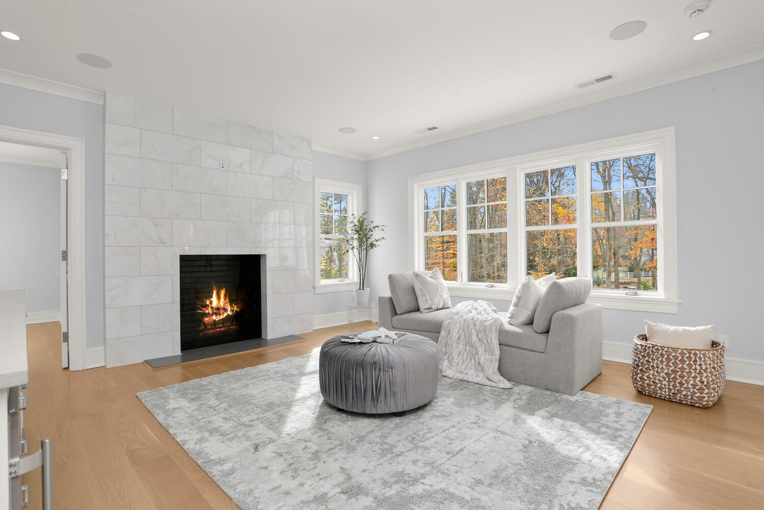 24 Country Club Road New Canaan, CT 06840 - Photo 29 of 43 a living room with furniture a fireplace and a large window