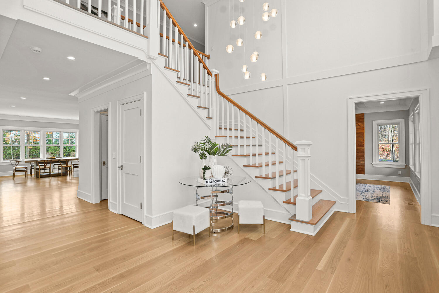 24 Country Club Road New Canaan, CT 06840 - Photo 4 of 43 a view of an entryway with wooden floor and windows