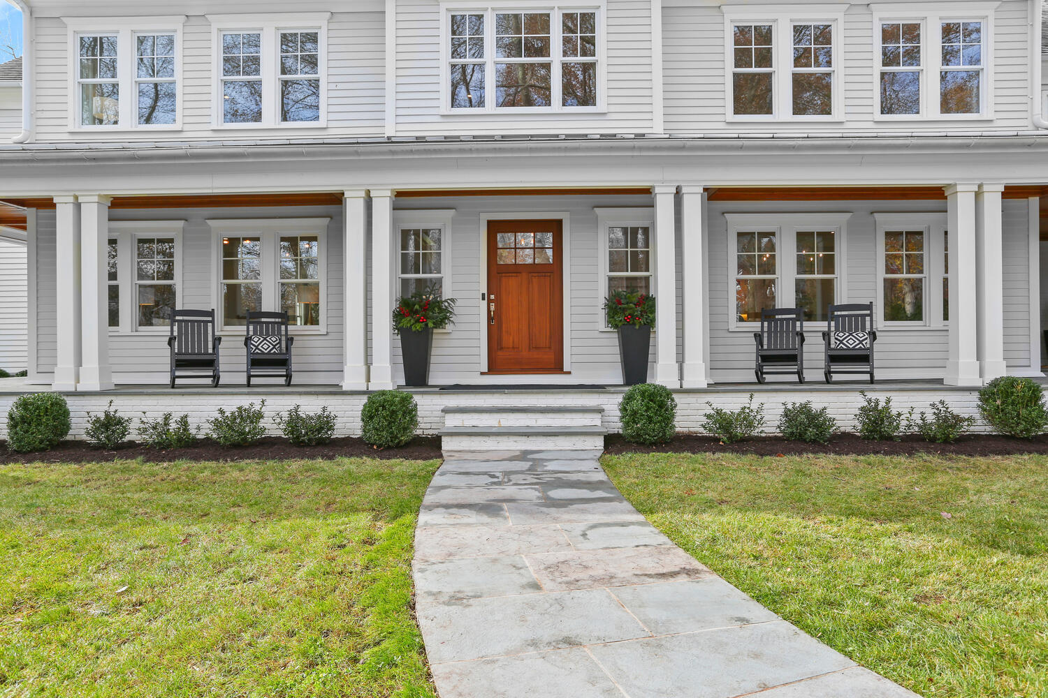 24 Country Club Road New Canaan, CT 06840 - Photo 42 of 43 a front view of a house with swimming pool and outdoor seating