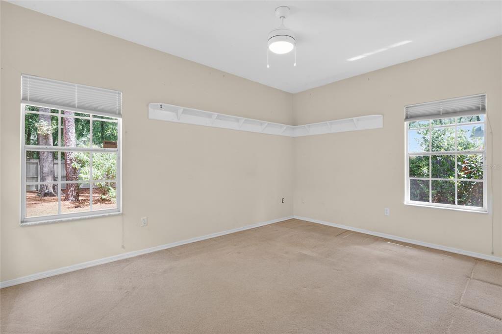 9626 Southwest 53rd Road Gainesville, FL 32608 - Photo 15 of 23 an empty room with a window