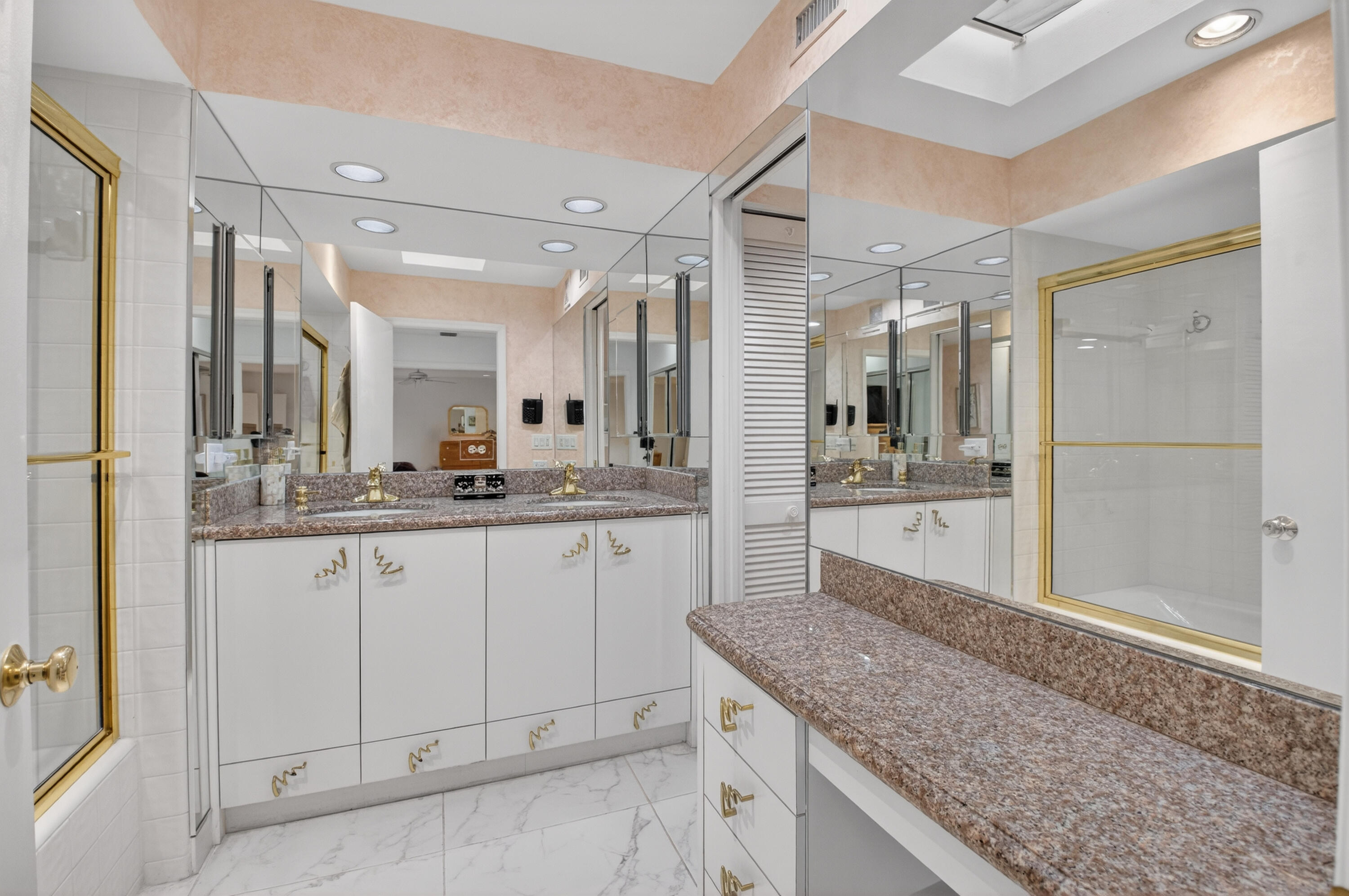 19620 Sawgrass Circle, Unit 2802 Boca Raton, FL 33434 - Photo 19 of 79 a bathroom with a granite countertop sink mirror and