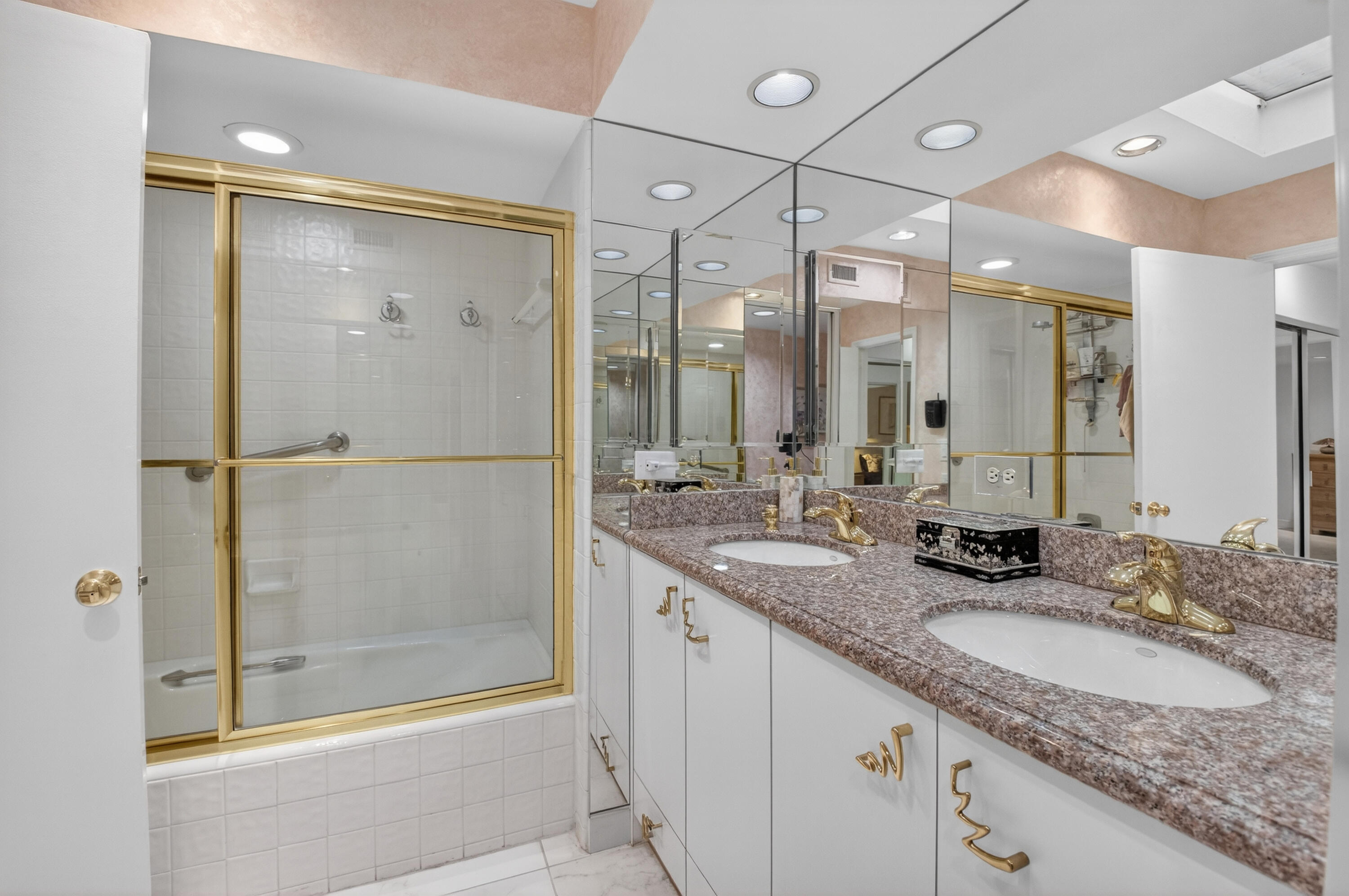 19620 Sawgrass Circle, Unit 2802 Boca Raton, FL 33434 - Photo 20 of 79 a bathroom with a granite countertop sink mirror and shower