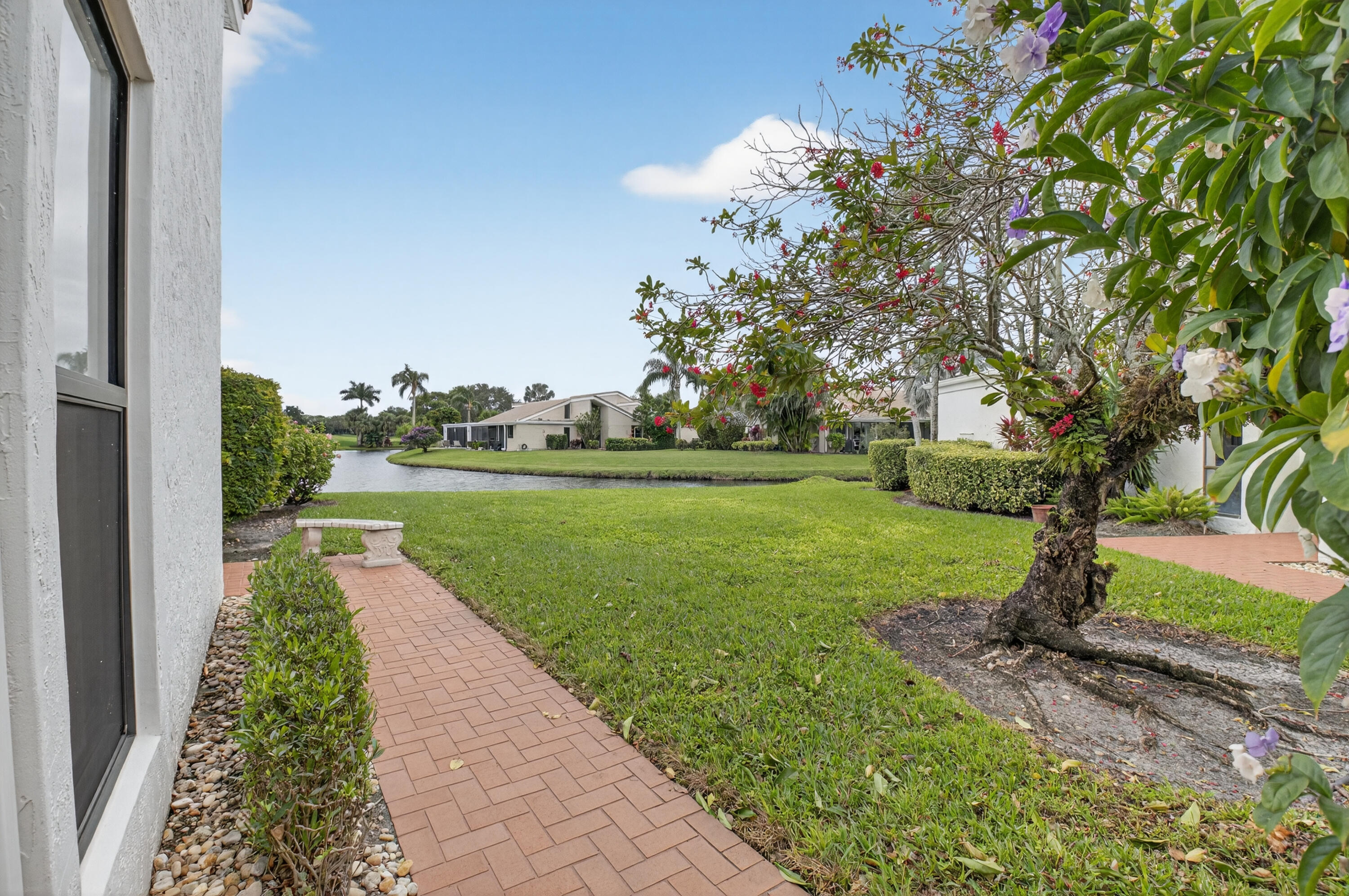 19620 Sawgrass Circle, Unit 2802 Boca Raton, FL 33434 - Photo 29 of 79 a view of a garden with a fountain