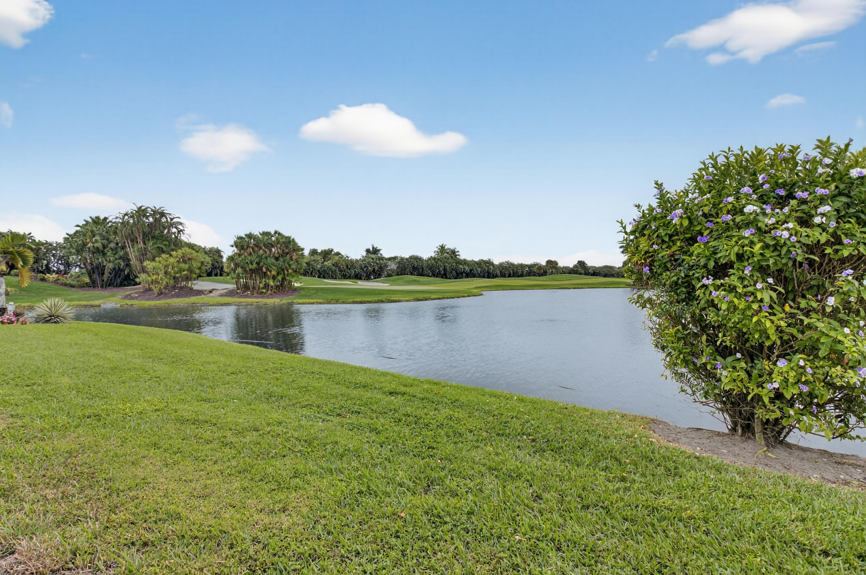 19620 Sawgrass Circle, Unit 2802 Boca Raton, FL 33434 - Photo 32 of 79 a view of a lake with a big yard