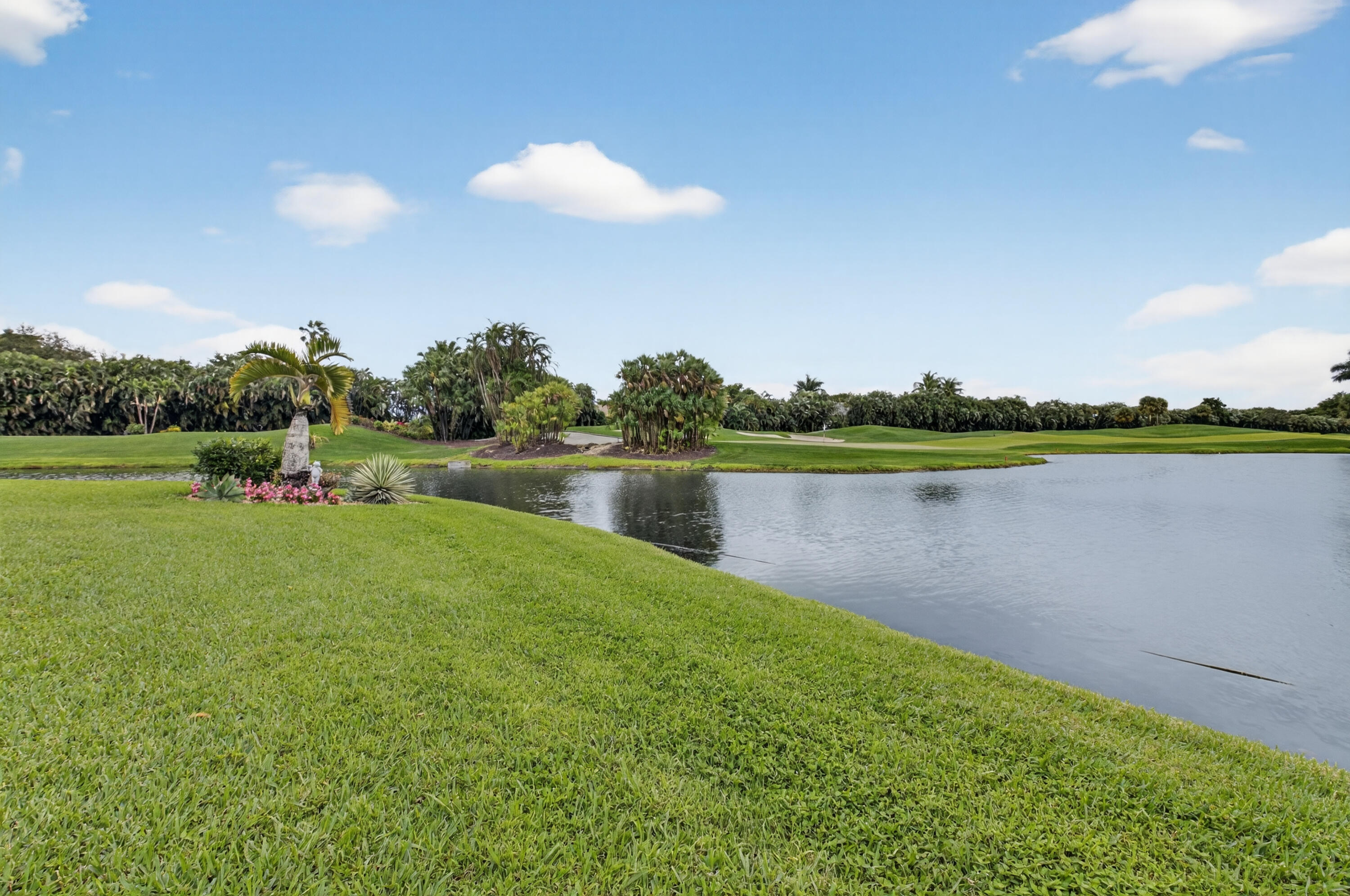 19620 Sawgrass Circle, Unit 2802 Boca Raton, FL 33434 - Photo 36 of 79 a view of a lake with a big yard