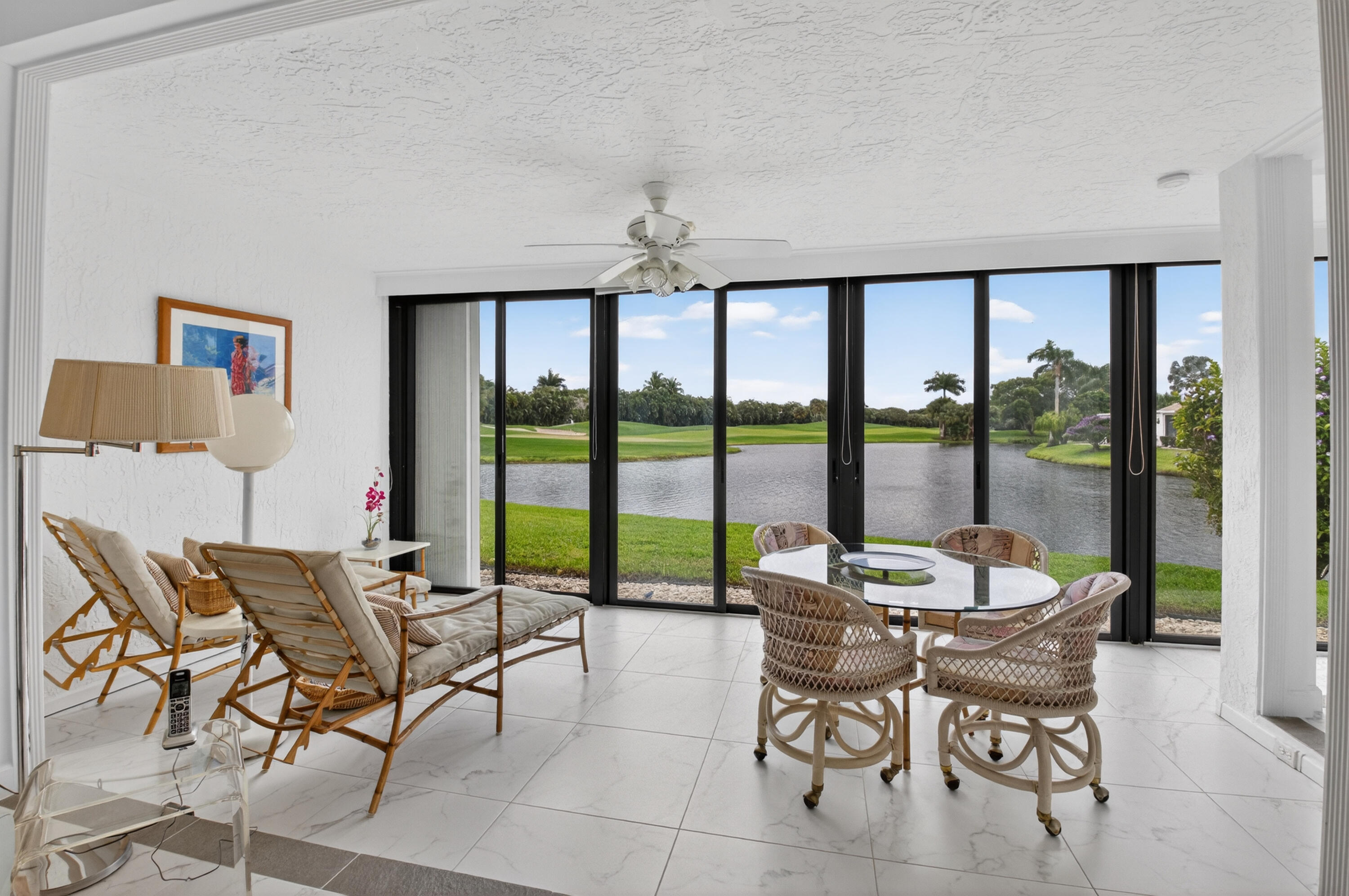 19620 Sawgrass Circle, Unit 2802 Boca Raton, FL 33434 - Photo 5 of 79 a dining room with furniture and large windows