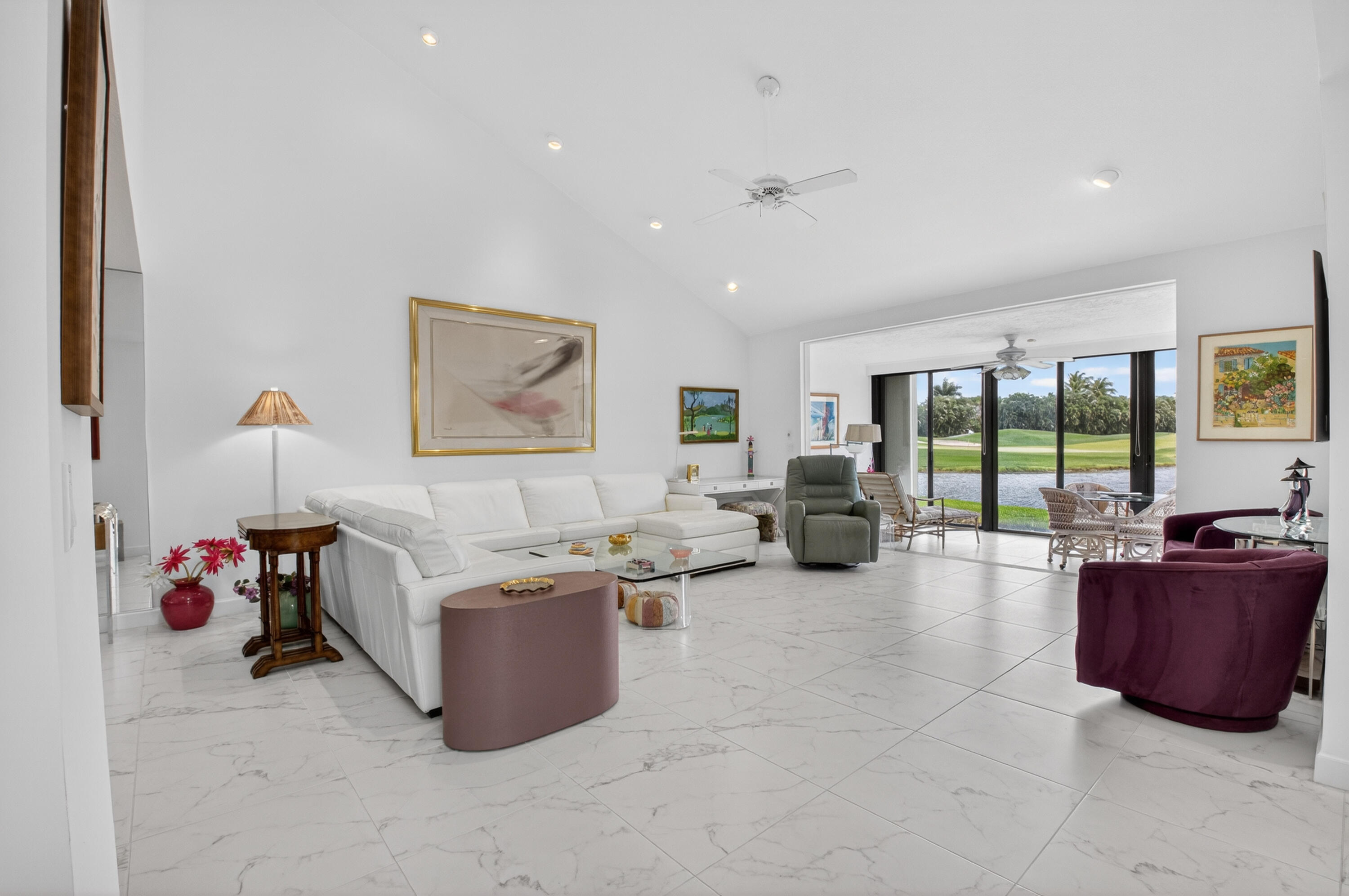 19620 Sawgrass Circle, Unit 2802 Boca Raton, FL 33434 - Photo 7 of 79 a living room with furniture and a flat screen tv