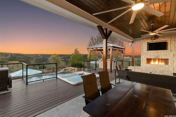 a view of a terrace with couches and pool