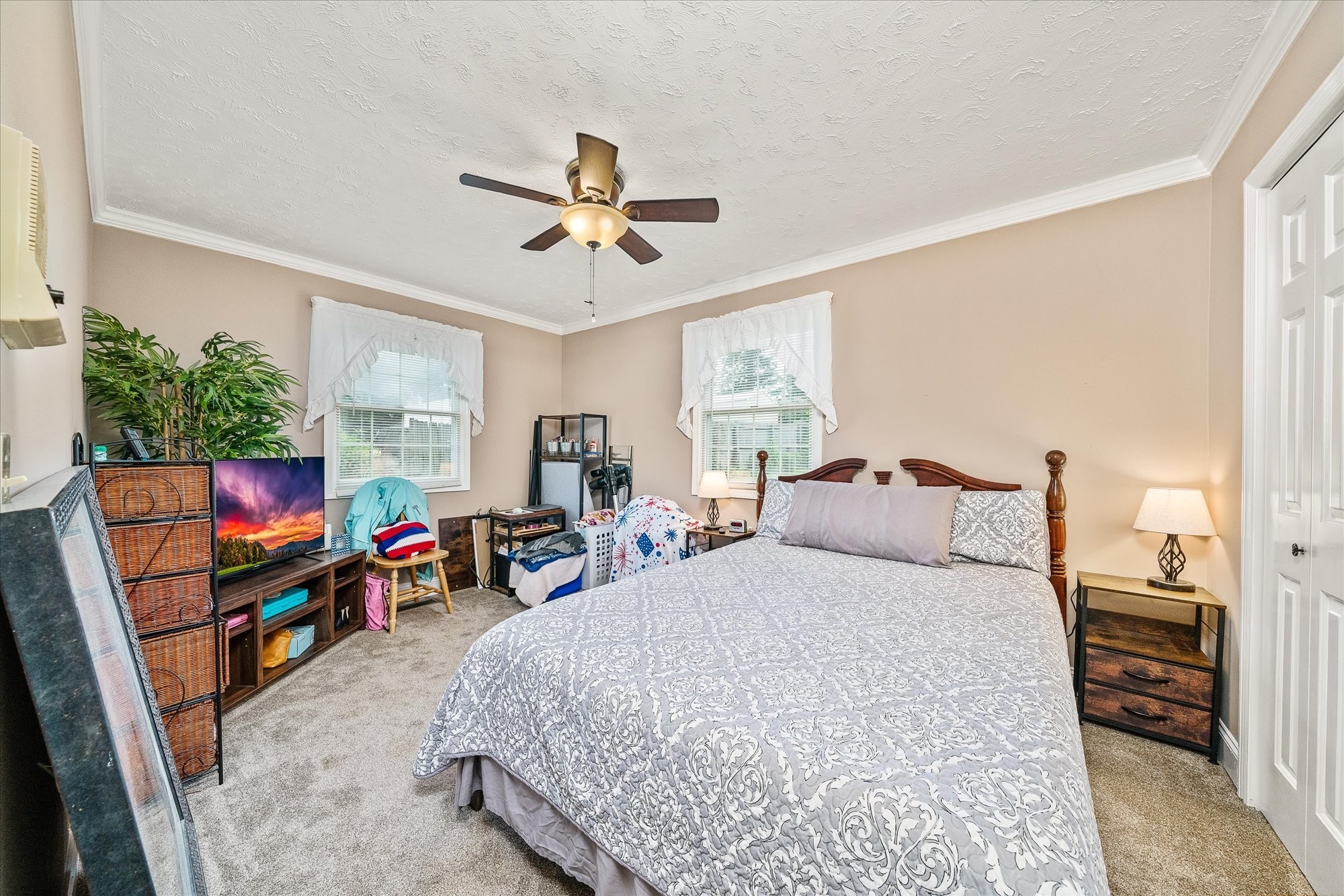 221 Magnolia Road Sparta, TN 38583 - Photo 14 of 36 a bed room with a bed a flat screen tv and a window