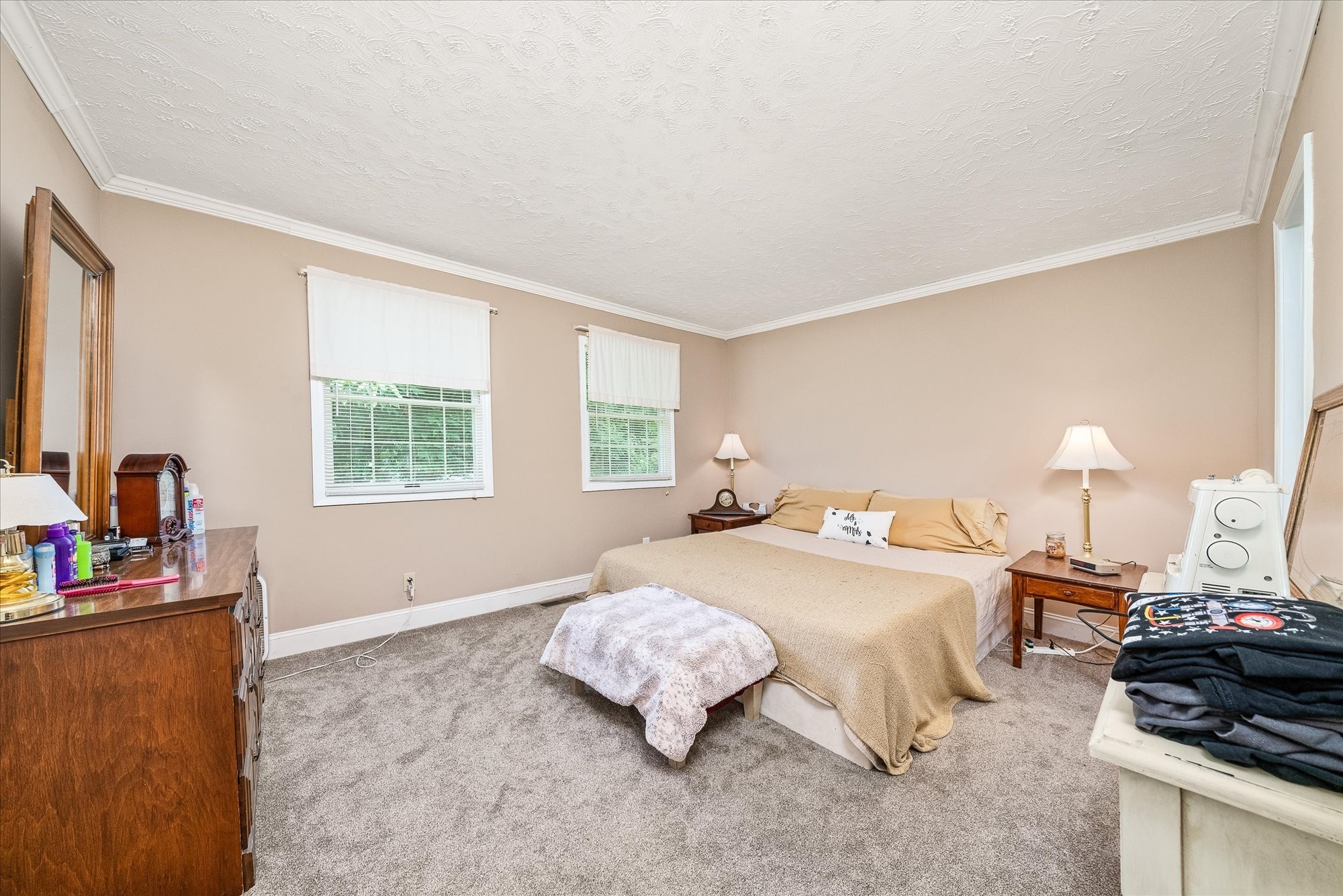 221 Magnolia Road Sparta, TN 38583 - Photo 16 of 36 a bedroom with a bed and a dresser next to a window