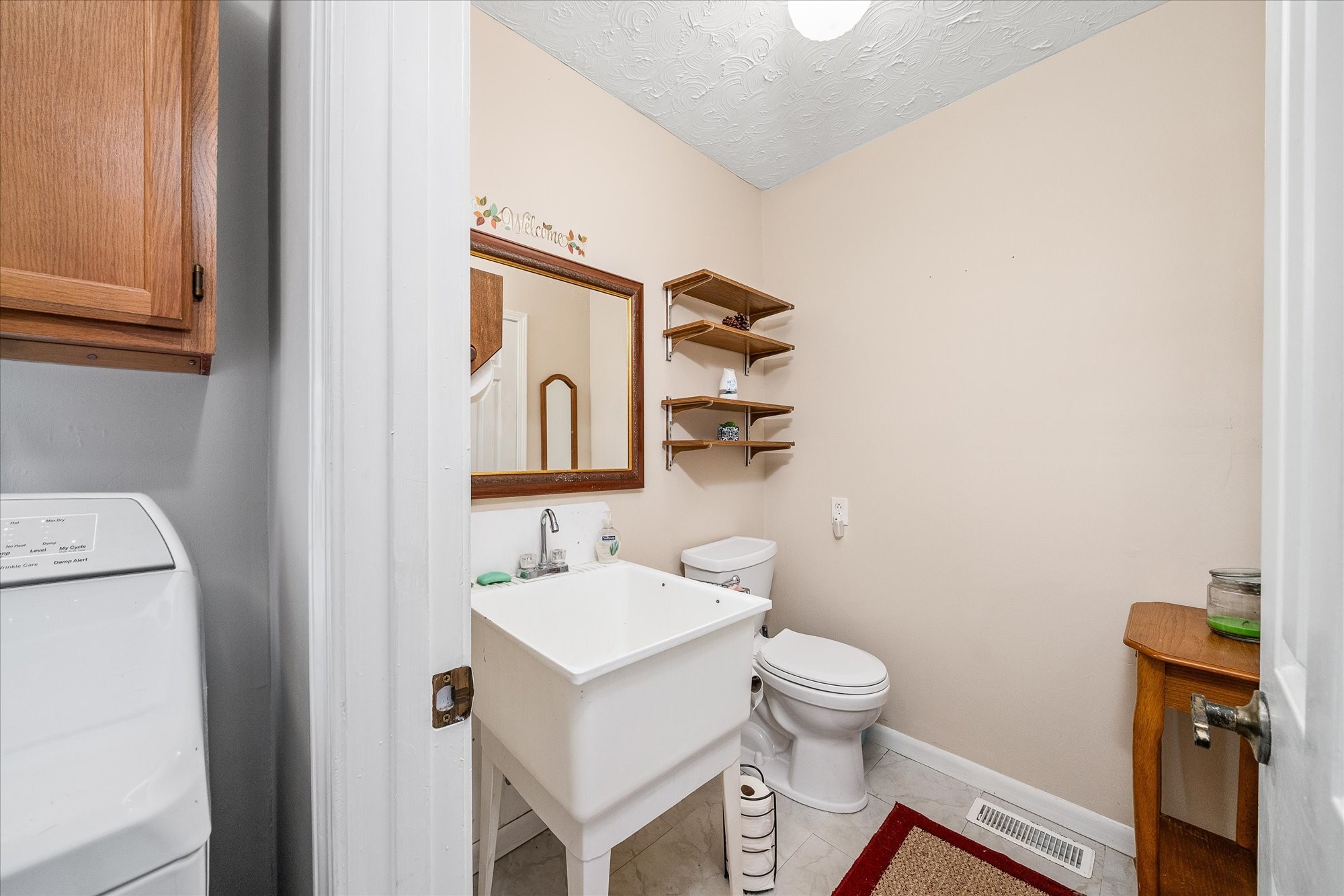 221 Magnolia Road Sparta, TN 38583 - Photo 20 of 36 a bathroom with a toilet a sink and a mirror
