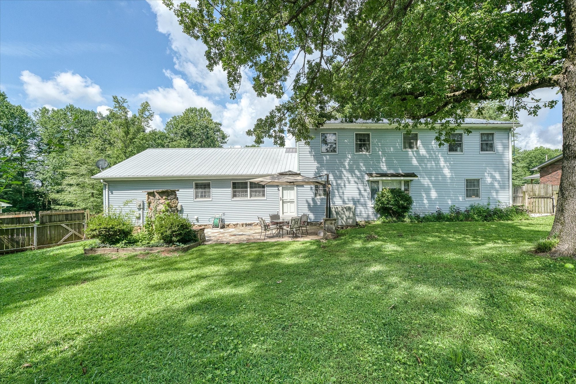221 Magnolia Road Sparta, TN 38583 - Photo 23 of 36 a front view of a house with garden