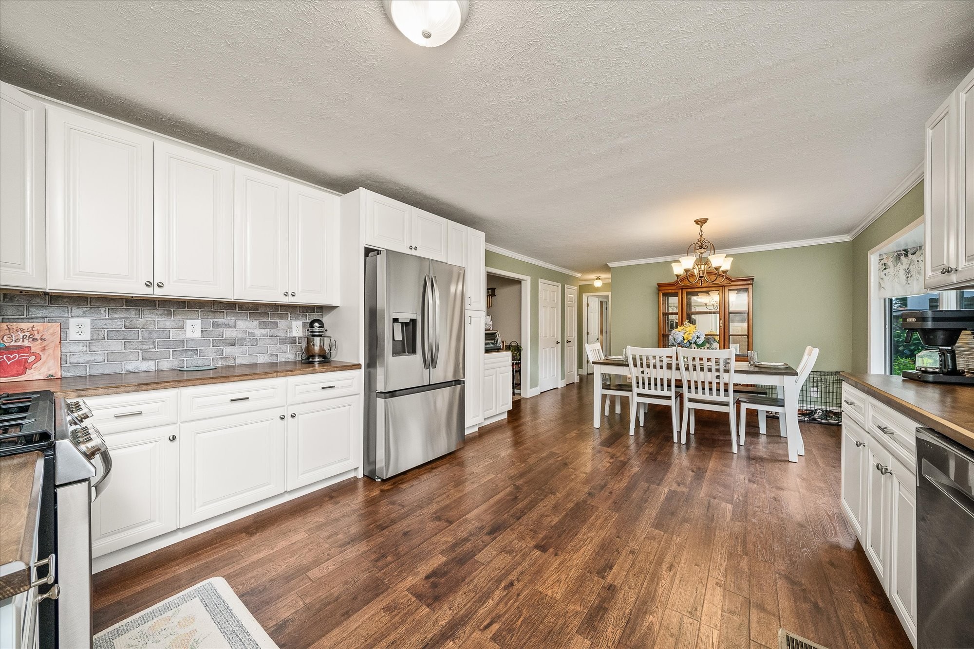 221 Magnolia Road Sparta, TN 38583 - Photo 4 of 36 a kitchen with white cabinets and wooden floor