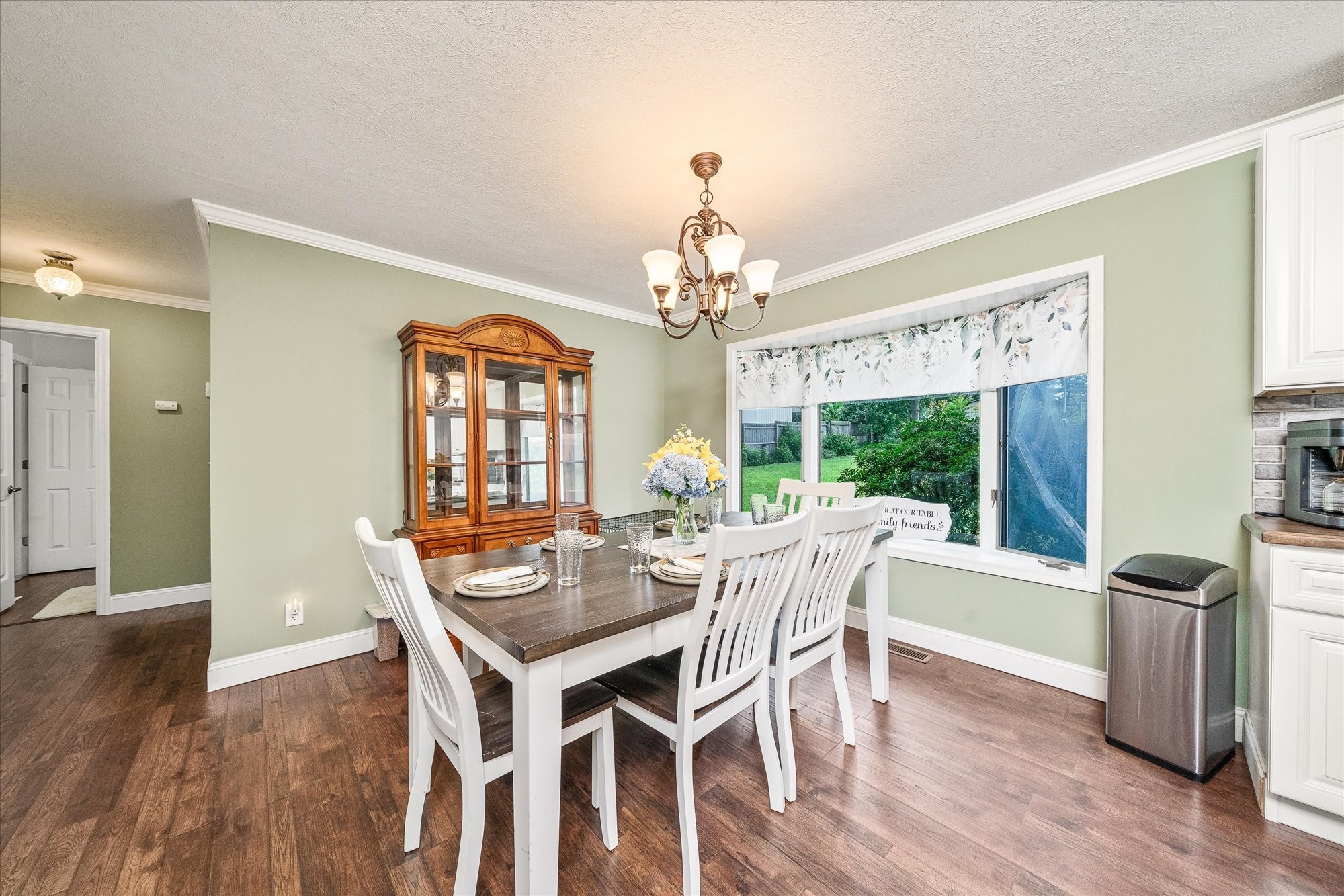 221 Magnolia Road Sparta, TN 38583 - Photo 5 of 36 a view of a dining room with furniture wooden floor and chandelier