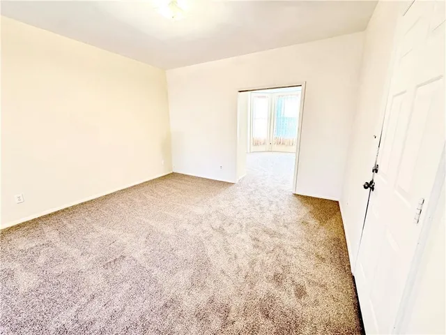 an empty room with wooden floor