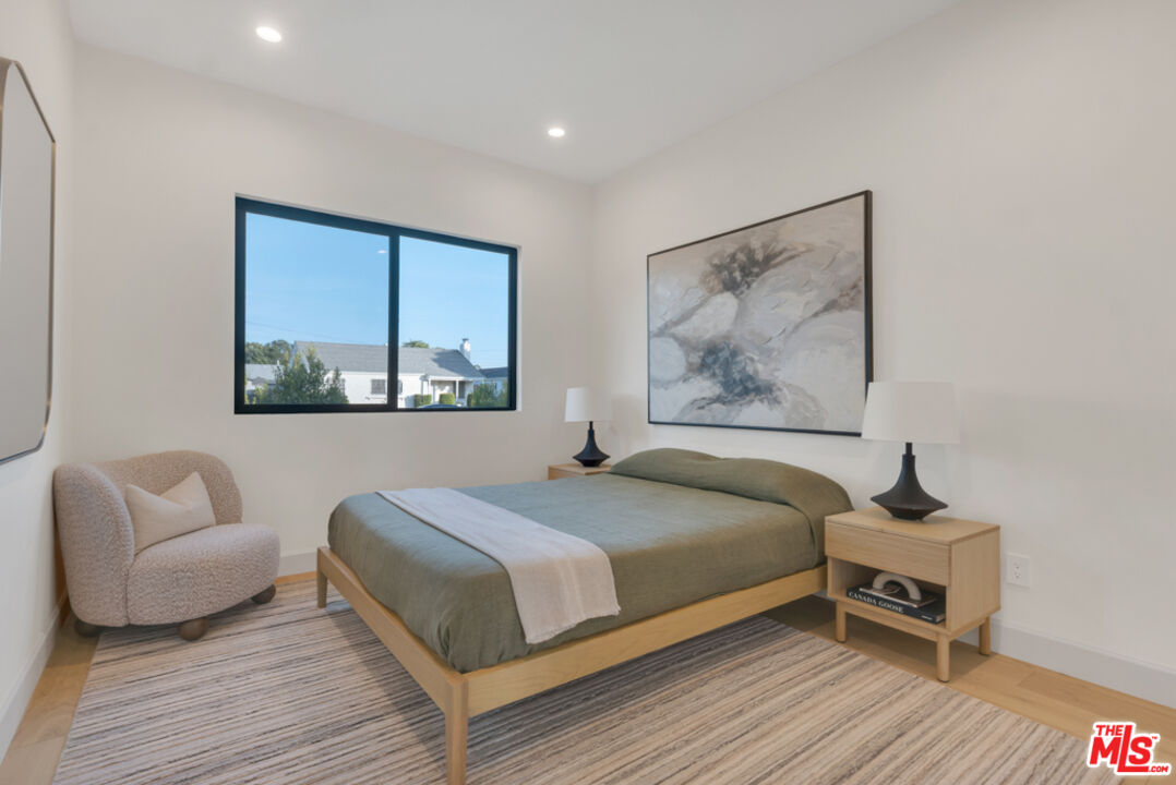 3617 Hillcrest Drive Los Angeles, CA 90016 - Photo 12 of 34 a bedroom with a bed and a couch